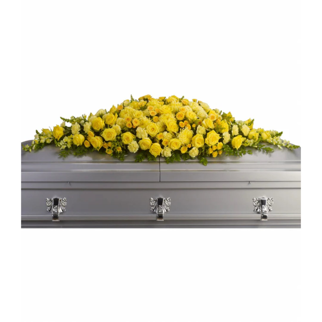 Golden Garden Casket with yellow floral arrangement