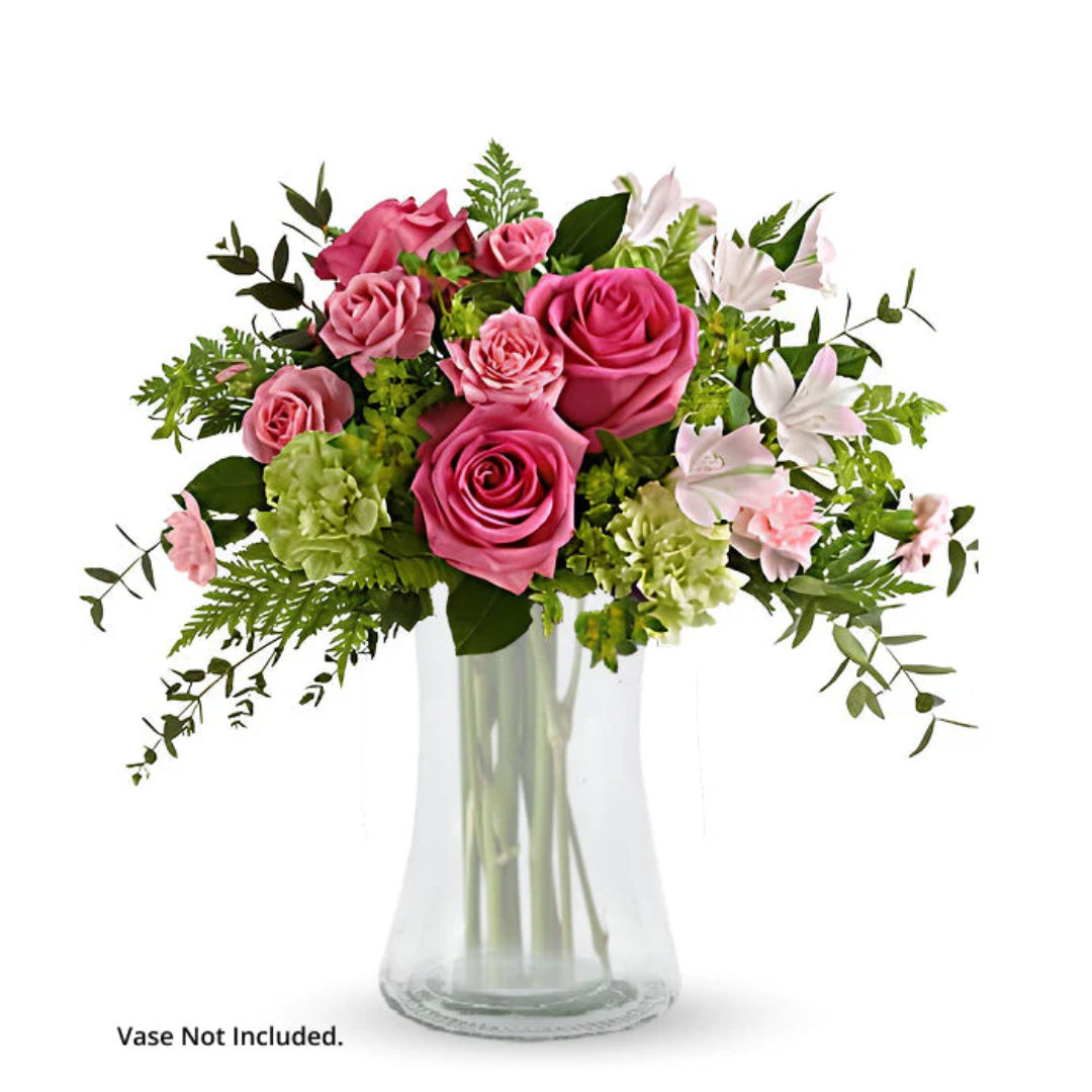 Green Twist bouquet of pink roses in vase