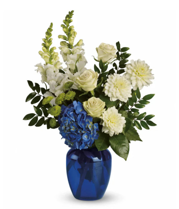 Pure Devotion floral arrangement in blue vase