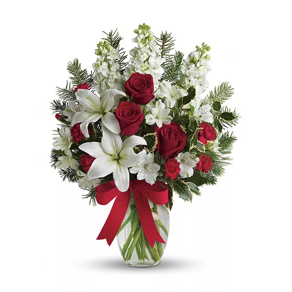 Holiday floral arrangement with red roses and white lilies
